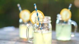 Lemonade in mason jars with paper straws