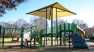 A large playground with multiple amenities for kids age 2-12 