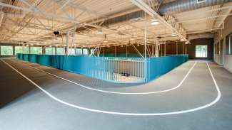 Indoor track with two white lines on rubberized surface