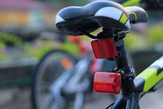 Back of bicycle with a red light attached