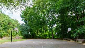 Outdoor basketball court with four hoops
