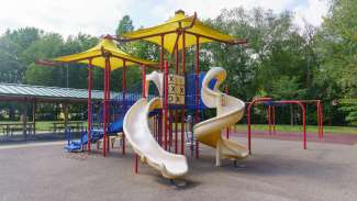 Play equipment with slides and climbing bars