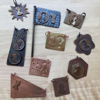 Various small pieces made from pennies and metal
