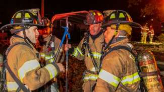 Raleigh fire fighters preparing to fight a fire