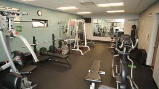 A fitness room with free weights, cardio machines and more at Worthdale Park