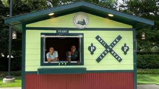 park staff working in a booth