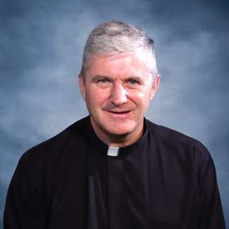 portrait of iCare team member Father Peter Devereux