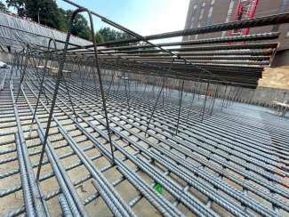 Image show a close up image of the rebar on the job site of civic tower. 