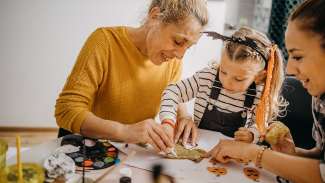 an intergenerational group of people making crafts 