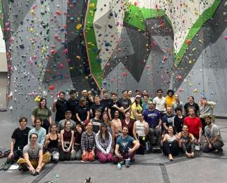 Group photo of Para-CliffHangers group in indoor climbing gym