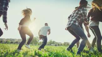 adults in a field doing activities