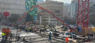 image show construction site with boom pump