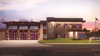 A night time view of a rendering of the new Fire Station 15 building