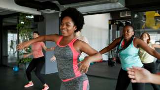 a group dancing class in the health club or gym