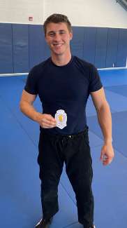 Officer Mills holding award