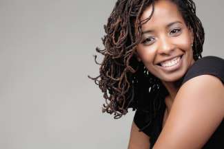 Artist Georgia Tardy smiles at the camera