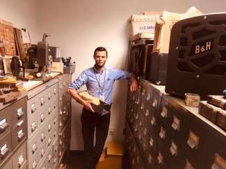 an image of Ian F.G Dunn surrounded by file cabinets