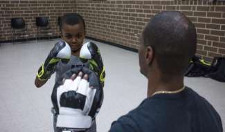 a boy practicing boxing