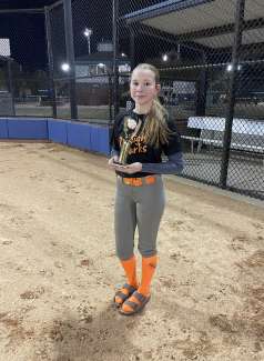 a girl holding an award