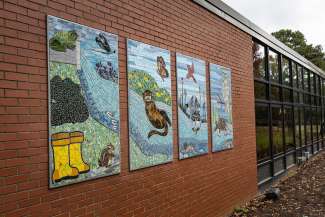 An image of the four mosaic panels attached to the community center