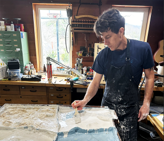 Image of artist Todd Frahm at work in his studio