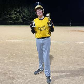baseball player holding a trophy