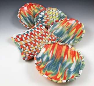 photo of five handbuilt colored porcelain dishes
