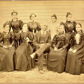 image of 9 individual sitting down