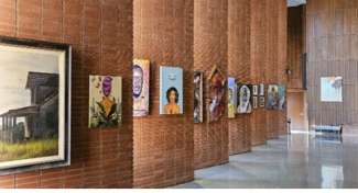 A brick wall with artwork displayed.