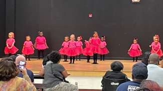 Children doing ballet on stage