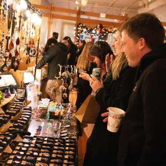 people shopping for gifts while enjoying a beverage