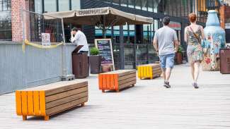 a walkway with wooden benches